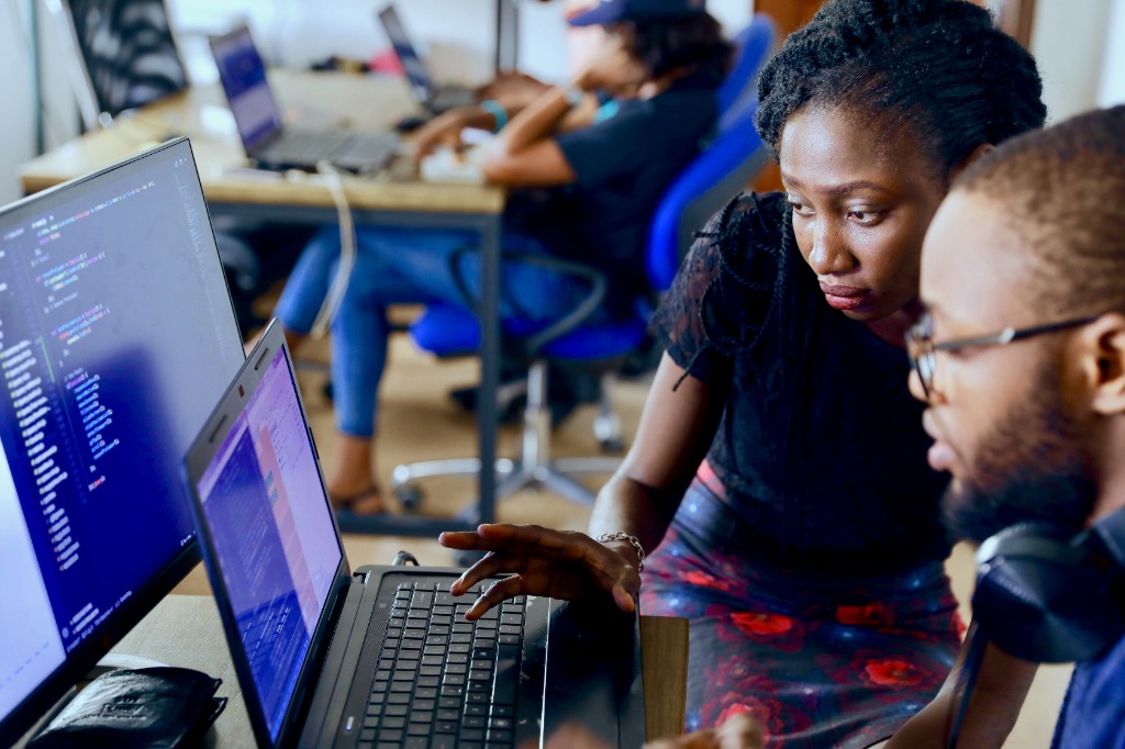 African tech students collaborating in a modern Staken Hub Academy lab